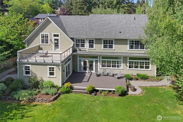 301 Weaver Rd NW, Bainbridge Island, WA 98110 - back of house featuring a lawn, a shingled roof, a deck, and french doors