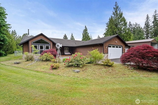 23405 Jordan Rd, Arlington, WA 98223 - view of front of property with an attached garage, a front yard, and asphalt driveway