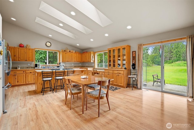 23405 Jordan Rd, Arlington, WA 98223 - dining room with lofted ceiling, a skylight, light wood-style floors, and recessed lighting