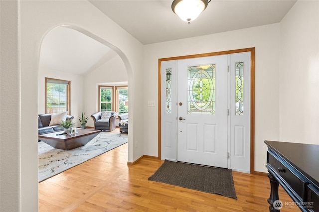 4239 Northridge Way, Bellingham, WA 98226 - foyer entrance featuring arched walkways, light wood-type flooring, baseboards, and lofted ceiling