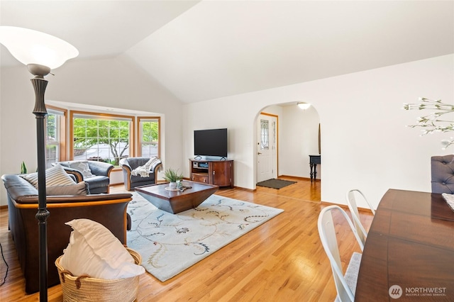 4239 Northridge Way, Bellingham, WA 98226 - living area featuring arched walkways, light wood-style flooring, and high vaulted ceiling
