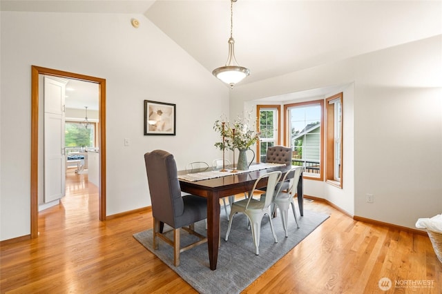 4239 Northridge Way, Bellingham, WA 98226 - dining area featuring light wood finished floors, baseboards, and high vaulted ceiling
