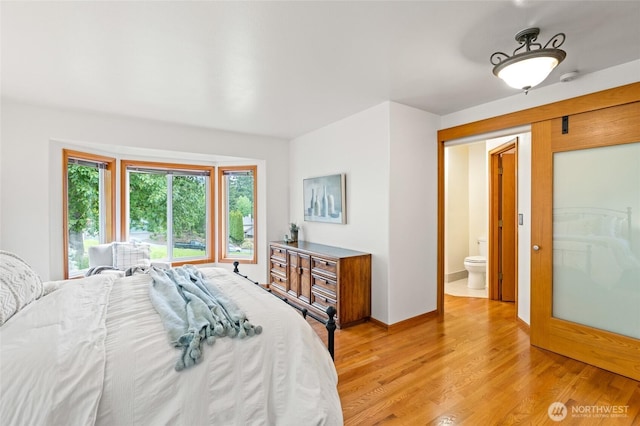 4239 Northridge Way, Bellingham, WA 98226 - bedroom featuring light wood-type flooring, baseboards, and connected bathroom