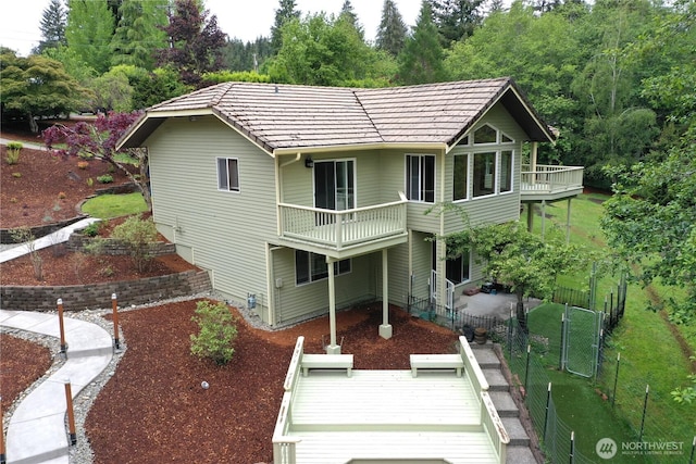 434 N 8th St, Montesano, WA 98563 - rear view of house featuring a fenced backyard and a balcony