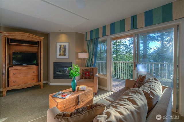 1917 Rosario Rd Unit 2104, Orcas Island, WA 98245 - carpeted living room featuring a glass covered fireplace and baseboards