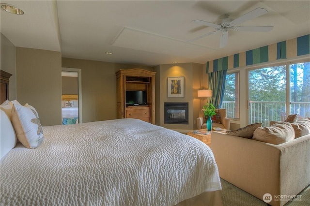 1917 Rosario Rd Unit 2104, Orcas Island, WA 98245 - bedroom featuring a glass covered fireplace, recessed lighting, and ceiling fan