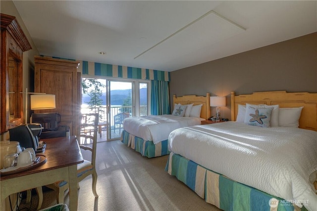 1917 Rosario Rd Unit 2104, Orcas Island, WA 98245 - bedroom featuring light carpet, access to outside, and wallpapered walls