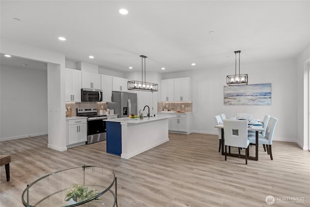2617 Spruce Rd Unit A, Lake Stevens, WA 98258 - kitchen with appliances with stainless steel finishes, light countertops, baseboards, recessed lighting, and backsplash