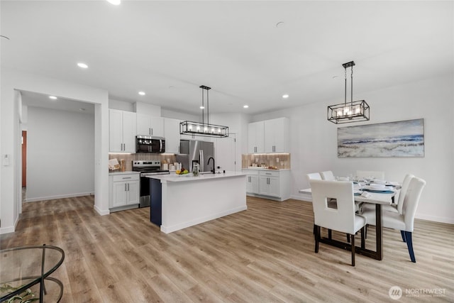 2617 Spruce Rd Unit A, Lake Stevens, WA 98258 - kitchen featuring appliances with stainless steel finishes, recessed lighting, tasteful backsplash, light countertops, and white cabinets
