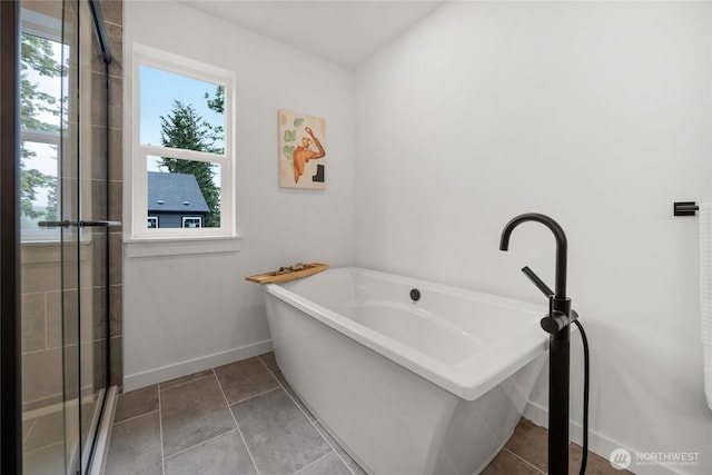 2617 Spruce Rd Unit A, Lake Stevens, WA 98258 - bathroom featuring a tub, baseboards, a tile shower, and tile patterned floors