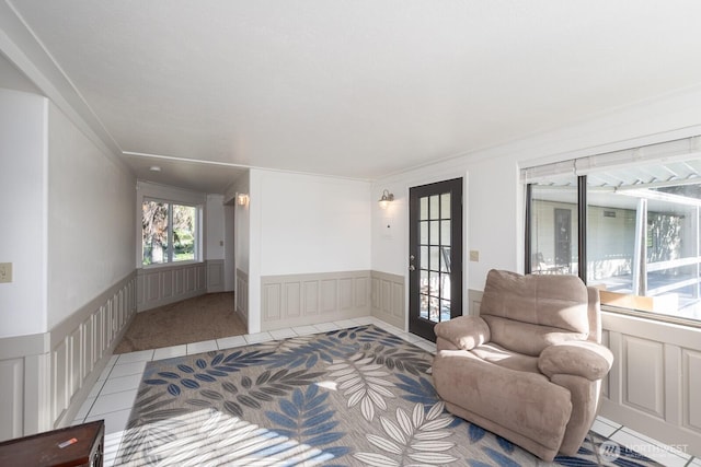 18226 Road B NW, Ephrata, WA 98823 - living area with a decorative wall, a wainscoted wall, and light carpet