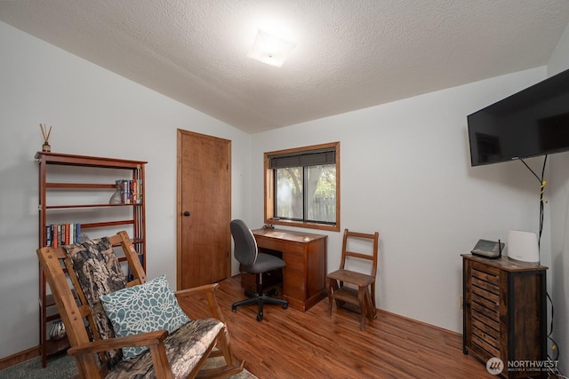 18226 Road B NW, Ephrata, WA 98823 - office area featuring vaulted ceiling, wood finished floors, and a textured ceiling