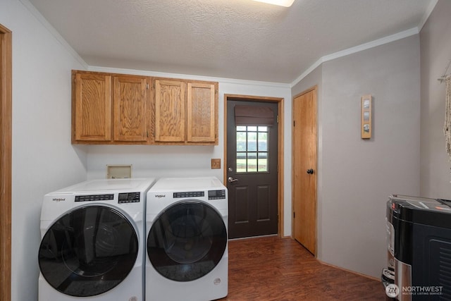 18226 Road B NW, Ephrata, WA 98823 - laundry room featuring independent washer and dryer, dark wood-style floors, cabinet space, and crown molding