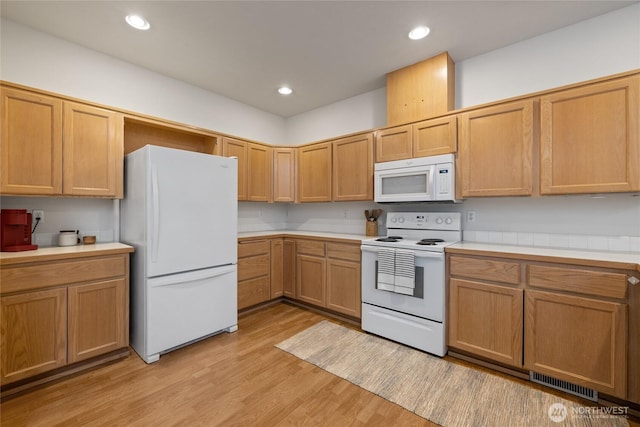 14126 95th Ave NW, Gig Harbor, WA 98329 - kitchen featuring white appliances, light countertops, light wood-type flooring, and recessed lighting