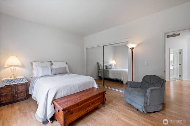 14126 95th Ave NW, Gig Harbor, WA 98329 - bedroom with light wood finished floors and a closet
