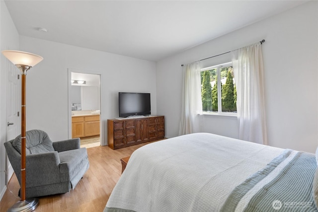 14126 95th Ave NW, Gig Harbor, WA 98329 - bedroom featuring light wood-style flooring and connected bathroom