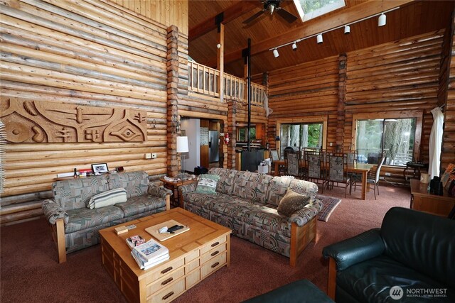 215 Marine Dr, Blakely Island, WA 98222 - living area with high vaulted ceiling, carpet, log walls, ceiling fan, and wood ceiling