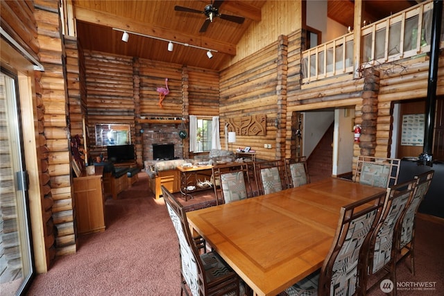 215 Marine Dr, Blakely Island, WA 98222 - dining area with wooden ceiling with exposed beams, carpet floors, rustic walls, a ceiling fan, and high vaulted ceiling