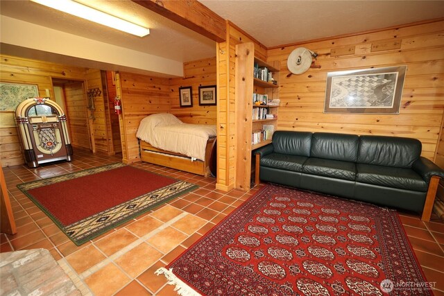 215 Marine Dr, Blakely Island, WA 98222 - bedroom featuring tile patterned floors and wood walls