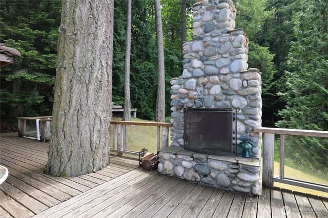 215 Marine Dr, Blakely Island, WA 98222 - wooden deck featuring an outdoor stone fireplace