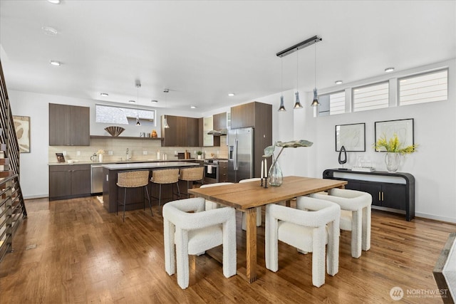 8838 Interlake Ave N, Seattle, WA 98103 - dining area featuring dark wood-style flooring, plenty of natural light, and recessed lighting
