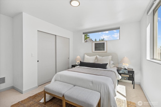 8838 Interlake Ave N, Seattle, WA 98103 - bedroom featuring light colored carpet, a closet, and baseboards