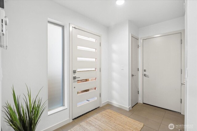 8838 Interlake Ave N, Seattle, WA 98103 - entryway featuring light tile patterned floors, baseboards, and recessed lighting