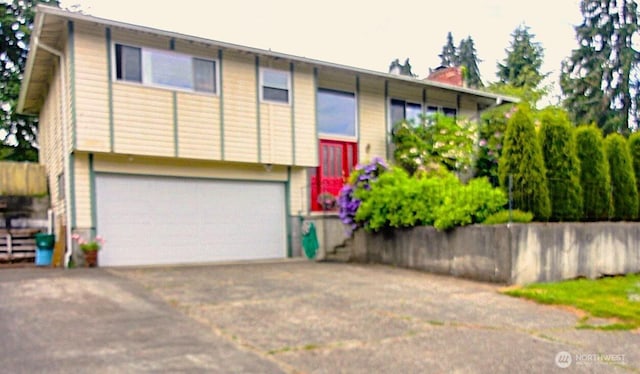 31405 10th Ave S, Federal Way, WA 98003 - raised ranch featuring driveway, an attached garage, and a chimney
