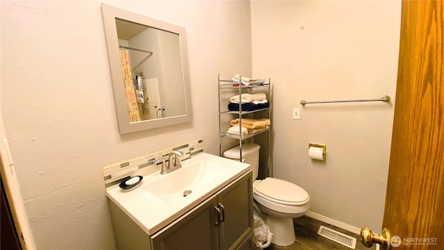 31405 10th Ave S, Federal Way, WA 98003 - full bath with vanity, toilet, baseboards, and wood finished floors