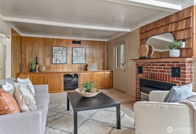 712 Fir St, Port Townsend, WA 98368 - carpeted living area with beverage cooler, a fireplace, wooden walls, and beam ceiling