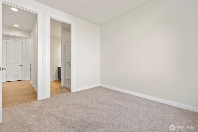 11210 79th Avenue Ct SW, Lakewood, WA 98498 - unfurnished bedroom with carpet floors, baseboards, and recessed lighting