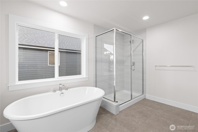 11210 79th Avenue Ct SW, Lakewood, WA 98498 - full bath featuring a freestanding bath, a shower stall, baseboards, tile patterned floors, and recessed lighting
