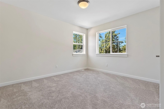 11210 79th Avenue Ct SW, Lakewood, WA 98498 - carpeted spare room featuring baseboards