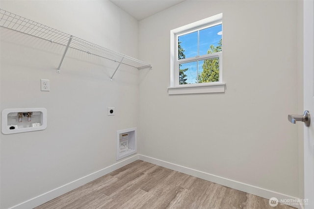 11210 79th Avenue Ct SW, Lakewood, WA 98498 - washroom with electric dryer hookup, light wood finished floors, baseboards, and washer hookup