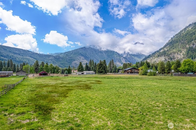 7938 E Leavenworth Rd, Leavenworth, WA 98826 - mountain view featuring rural landscape, a pastoral area, and a heavily wooded area