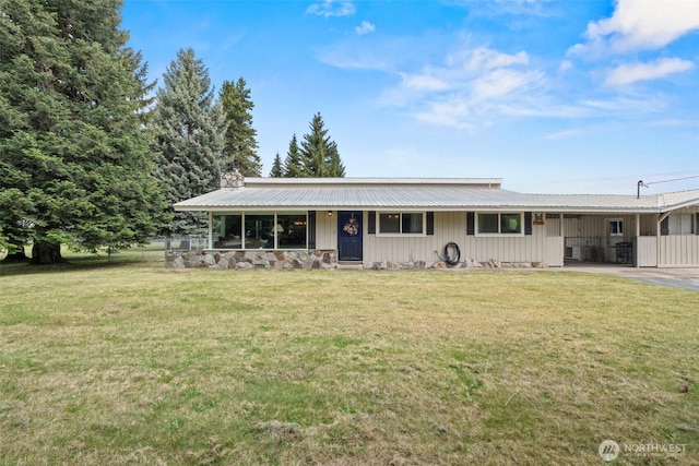 7938 E Leavenworth Rd, Leavenworth, WA 98826 - view of front facade with a front lawn, metal roof, a chimney, and board and batten siding
