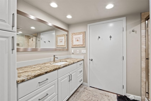 7938 E Leavenworth Rd, Leavenworth, WA 98826 - full bath featuring vanity, tiled shower, recessed lighting, and baseboards