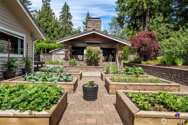 28118 163rd St E, Wilkeson, WA 98396 - view of patio / terrace with a vegetable garden