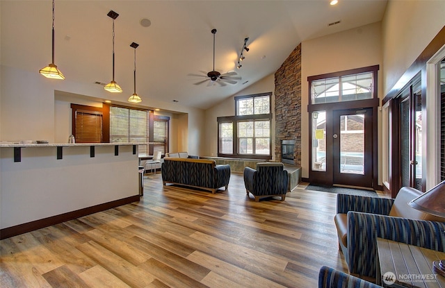 10800 SE 17th Cir Unit D50, Vancouver, WA 98664 - living room with wood finished floors, high vaulted ceiling, a ceiling fan, and a fireplace