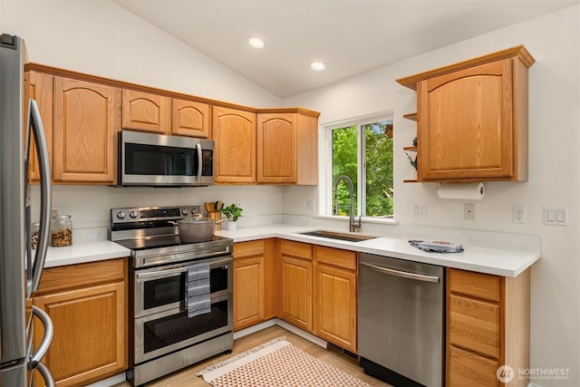 3816 NE 110th St, Seattle, WA 98125 - kitchen with appliances with stainless steel finishes, vaulted ceiling, light countertops, and recessed lighting