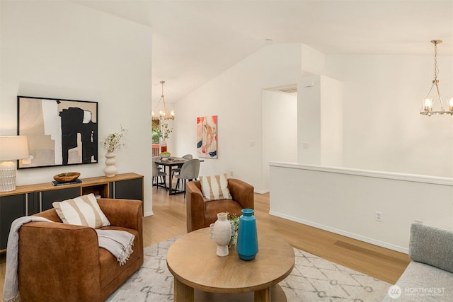 3816 NE 110th St, Seattle, WA 98125 - living room featuring a chandelier, light wood-type flooring, and lofted ceiling