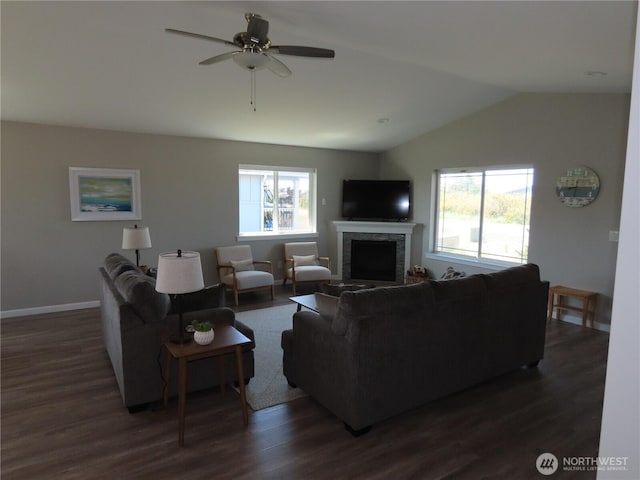 417 Riviera St SW, Ocean Shores, WA 98569 - living area featuring lofted ceiling, dark wood finished floors, a fireplace, baseboards, and ceiling fan