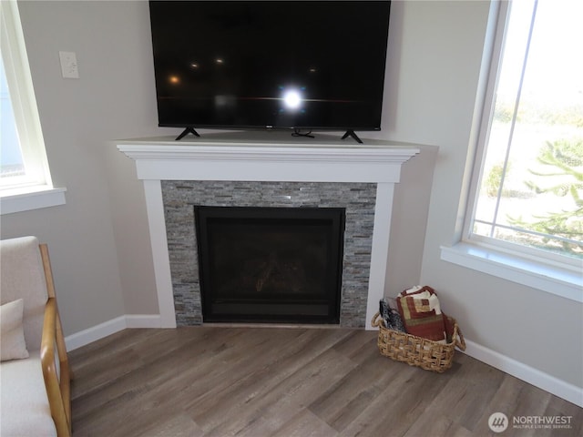 417 Riviera St SW, Ocean Shores, WA 98569 - detailed view of a fireplace, wood finished floors, and baseboards