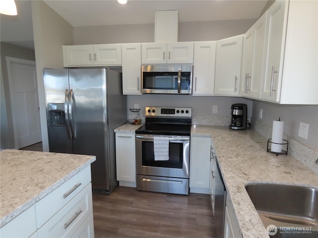 417 Riviera St SW, Ocean Shores, WA 98569 - kitchen with stainless steel appliances, white cabinets, dark wood-style flooring, recessed lighting, and a sink