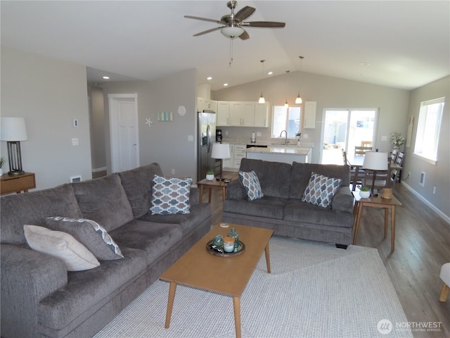 417 Riviera St SW, Ocean Shores, WA 98569 - living room with wood finished floors, a ceiling fan, vaulted ceiling, recessed lighting, and baseboards