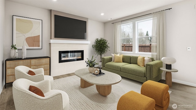 13473 NE 105th Ct Unit 12, Kirkland, WA 98033 - living room with wood finished floors, a glass covered fireplace, recessed lighting, and baseboards