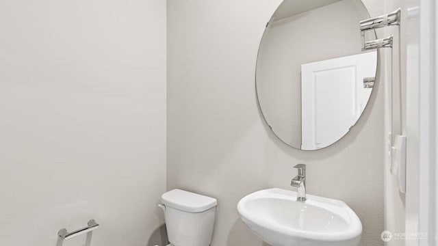 13473 NE 105th Ct Unit 12, Kirkland, WA 98033 - half bathroom featuring a sink and toilet