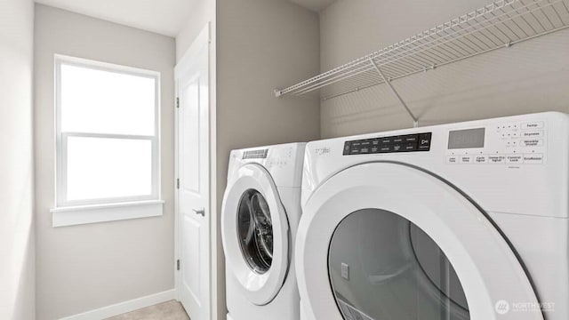 13473 NE 105th Ct Unit 12, Kirkland, WA 98033 - laundry room featuring washer and clothes dryer and baseboards