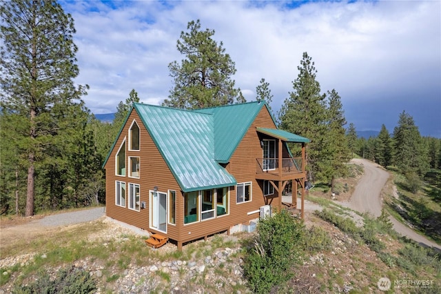 11 Appaloosa Rd, Winthrop, WA 98862 - back of property with a balcony and metal roof