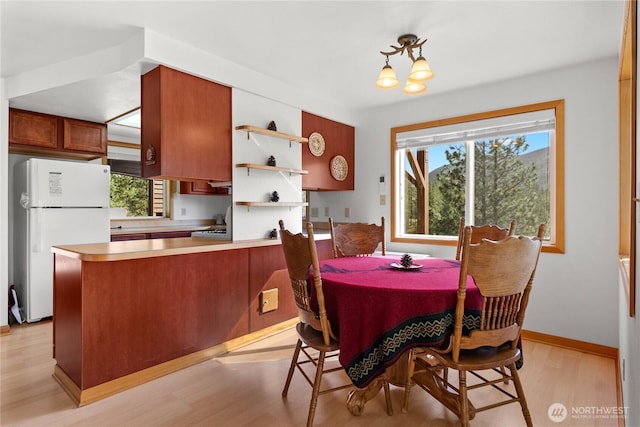 11 Appaloosa Rd, Winthrop, WA 98862 - dining area featuring light wood-style floors and a chandelier